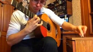 Гений играет на гитаре и ручке - смотреть видео (2:25)