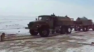 Пёс помогает завести бульдозер - смотреть видео (2:25)